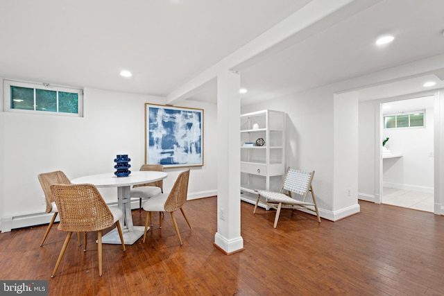 dining room featuring recessed lighting, baseboards, wood finished floors, and a baseboard radiator