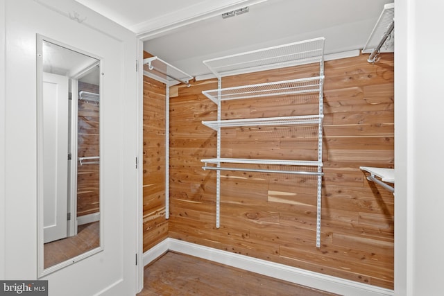 spacious closet featuring wood finished floors