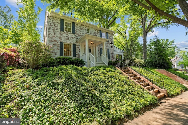 colonial inspired home featuring stairway