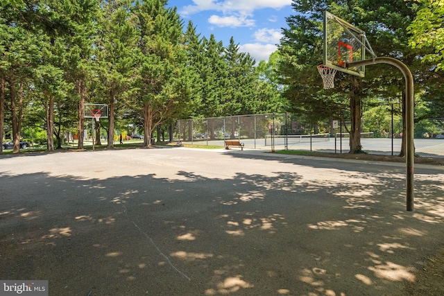 view of sport court featuring fence and community basketball court