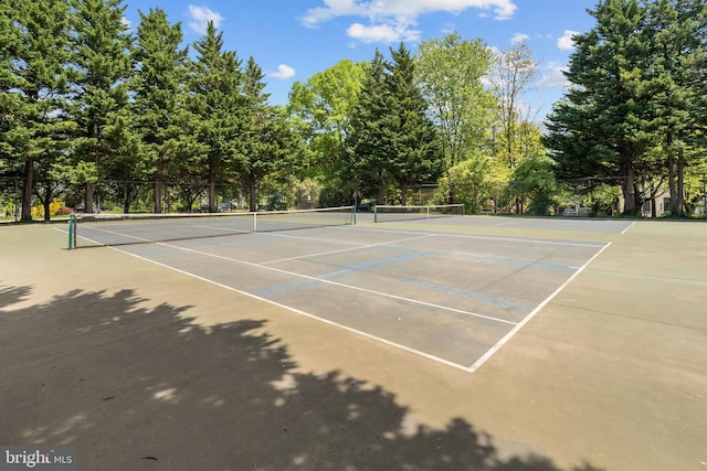 view of sport court featuring fence and community basketball court