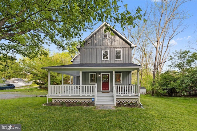 26101 Frederick Rd, Clarksburg, MD 20871 - farmhouse-style home featuring covered porch, board and batten siding, and a front lawn