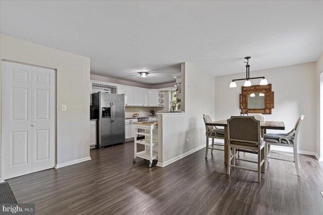 26101 Frederick Rd, Clarksburg, MD 20871 - dining space with dark wood-type flooring and baseboards