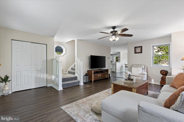 26101 Frederick Rd, Clarksburg, MD 20871 - living area with baseboards, ceiling fan, stairs, and dark wood-style floors