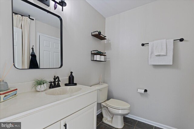 26101 Frederick Rd, Clarksburg, MD 20871 - bathroom with vanity, tile patterned flooring, baseboards, and toilet