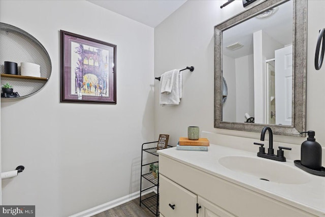 26101 Frederick Rd, Clarksburg, MD 20871 - bathroom with visible vents, a shower, wood finished floors, vanity, and baseboards