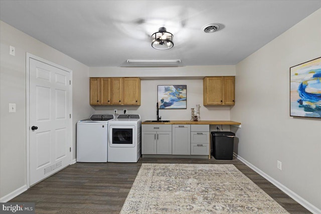26101 Frederick Rd, Clarksburg, MD 20871 - clothes washing area featuring baseboards, washer and clothes dryer, cabinet space, and dark wood-style flooring