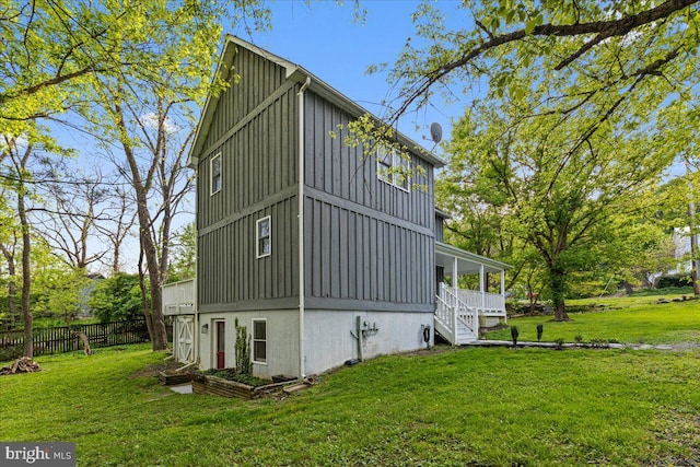 26101 Frederick Rd, Clarksburg, MD 20871 - view of home's exterior featuring board and batten siding, fence, and a yard