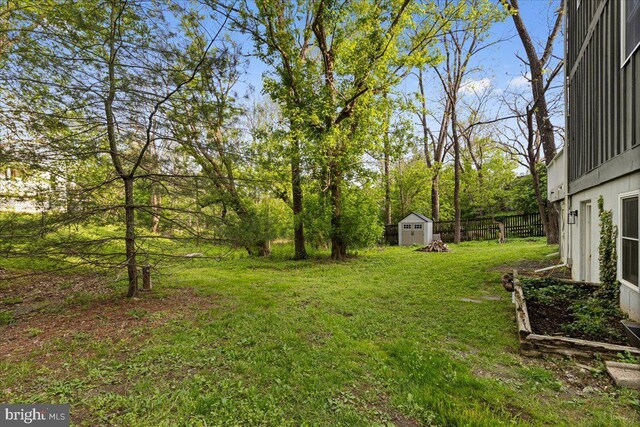 26101 Frederick Rd, Clarksburg, MD 20871 - view of yard featuring a storage shed, fence, and an outbuilding