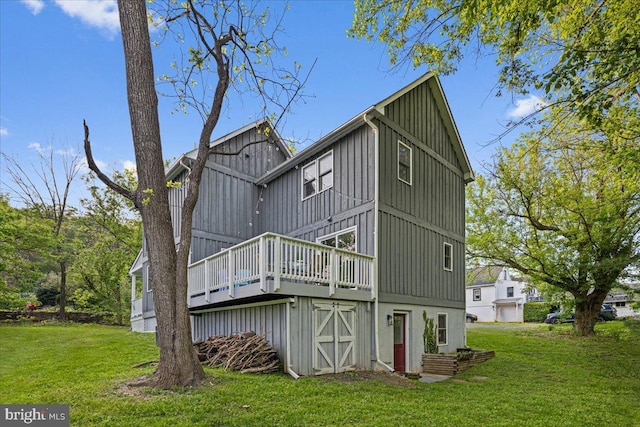 26101 Frederick Rd, Clarksburg, MD 20871 - rear view of property featuring a lawn, board and batten siding, and a deck