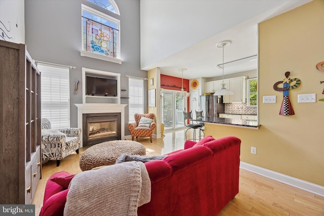 11 Weaver Dr, Evesham, NJ 08053 - living room featuring plenty of natural light, light wood-type flooring, and a glass covered fireplace