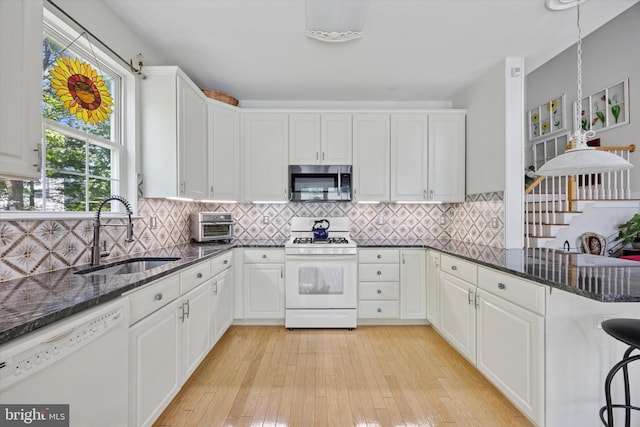 11 Weaver Dr, Evesham, NJ 08053 - kitchen featuring white appliances, a sink, white cabinets, dark stone countertops, and light wood finished floors