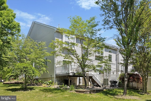 11 Weaver Dr, Evesham, NJ 08053 - rear view of house with a wooden deck, stairway, and a lawn