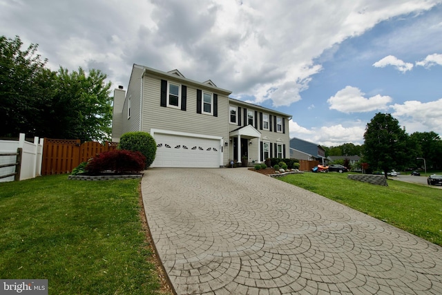 10505 Manor View Pl, Manassas, VA 20110 - view of front of house featuring a garage, fence, a front yard, a chimney, and driveway