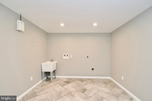 10505 Manor View Pl, Manassas, VA 20110 - clothes washing area with baseboards, electric dryer hookup, washer hookup, and laundry area