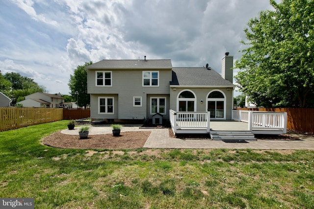 10505 Manor View Pl, Manassas, VA 20110 - rear view of property featuring a fenced backyard, a chimney, a yard, and a patio area
