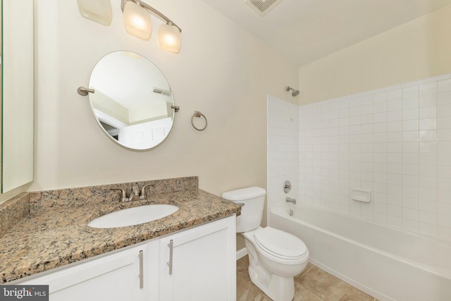 bathroom with toilet, vanity,  shower combination, tile patterned floors, and baseboards