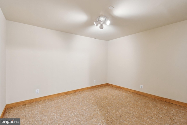 empty room with baseboards