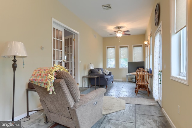 2038 E Harrisburg Pike, Middletown, PA 17057 - living area with a ceiling fan, french doors, stone tile flooring, baseboards, and visible vents