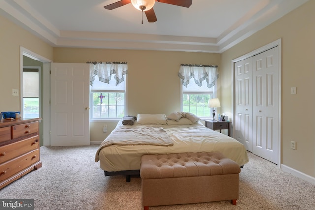 2038 E Harrisburg Pike, Middletown, PA 17057 - carpeted bedroom featuring multiple windows, a closet, a tray ceiling, and ceiling fan