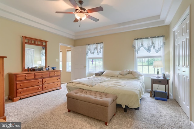 2038 E Harrisburg Pike, Middletown, PA 17057 - bedroom with a tray ceiling, carpet, a closet, and a ceiling fan