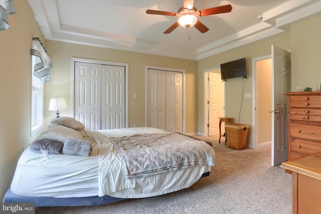 2038 E Harrisburg Pike, Middletown, PA 17057 - bedroom featuring light colored carpet, a ceiling fan, a raised ceiling, and multiple closets