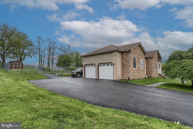 2038 E Harrisburg Pike, Middletown, PA 17057 - view of side of property with stone siding, driveway, an attached garage, and a lawn
