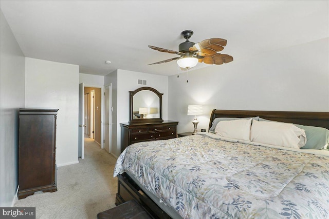 bedroom featuring carpet flooring, baseboards, visible vents, and ceiling fan
