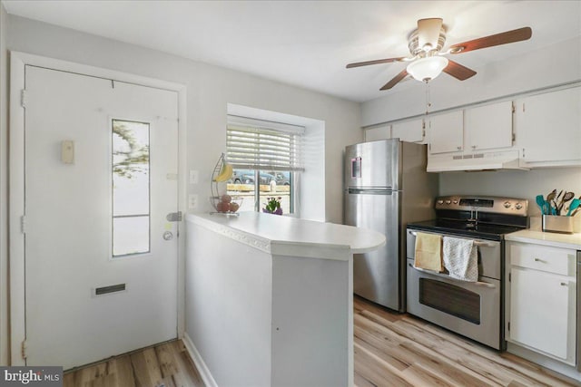 kitchen featuring light wood-style flooring, light countertops, under cabinet range hood, stainless steel appliances, and white cabinetry