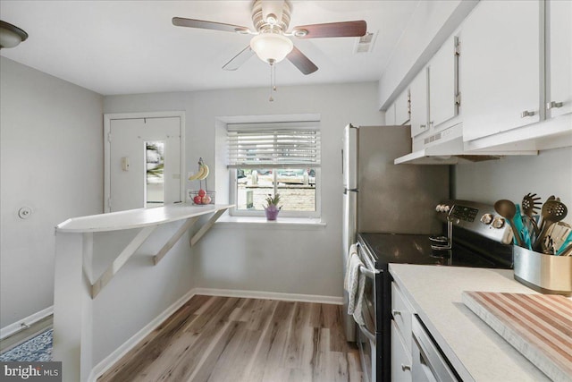 kitchen with light wood-style floors, visible vents, baseboards, stainless steel electric stove, and white cabinetry