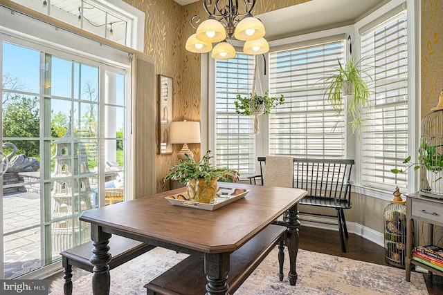 dining space with a notable chandelier and a healthy amount of sunlight