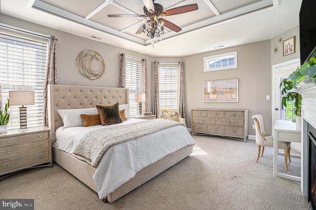 bedroom with multiple windows, light carpet, coffered ceiling, and visible vents