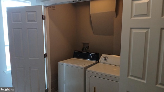 washroom with laundry area and washer and clothes dryer