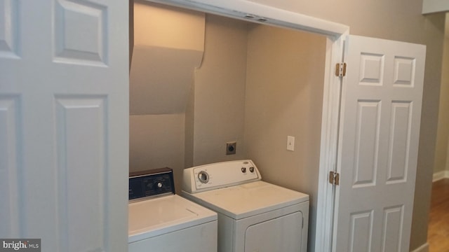 clothes washing area featuring laundry area and independent washer and dryer