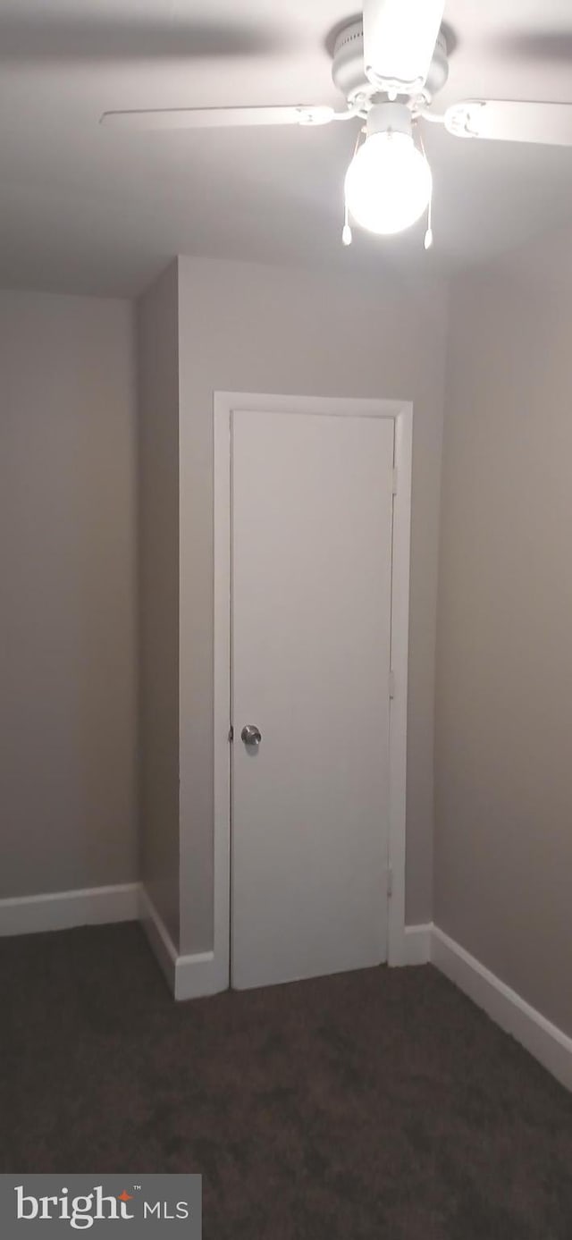 unfurnished room featuring baseboards