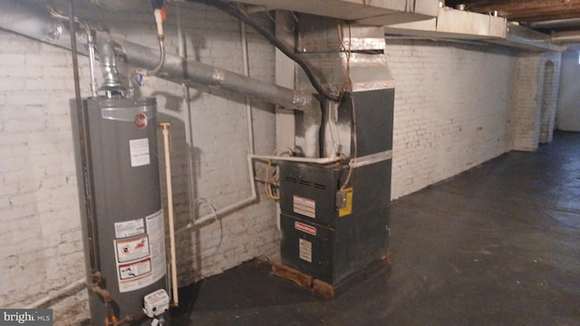 utility room featuring water heater
