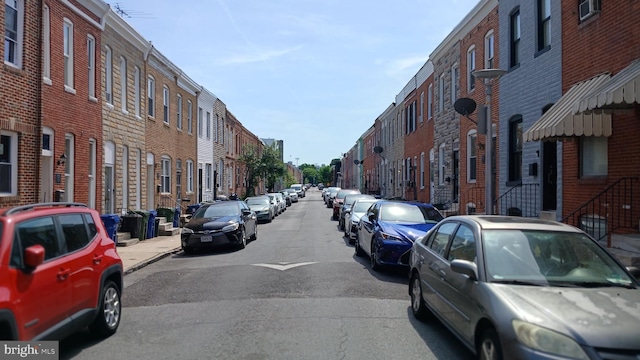 view of road featuring sidewalks and a residential view