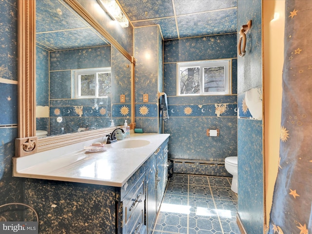 bathroom featuring vanity, tile patterned floors, wallpapered walls, and toilet