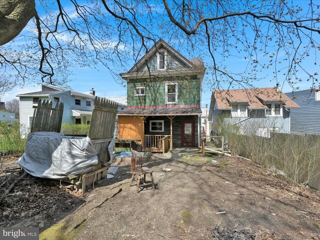 back of house featuring fence