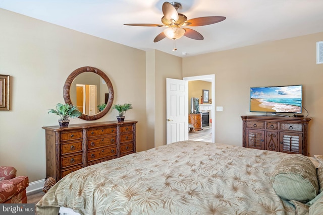 bedroom featuring ceiling fan and baseboards