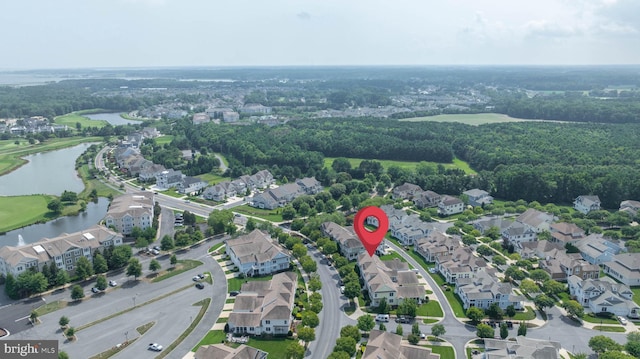 drone / aerial view featuring a water view and a residential view