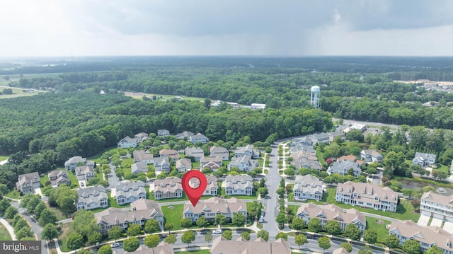 aerial view featuring a view of trees and a residential view