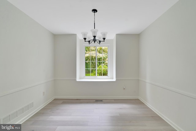 431 Eagle Rd Unit 16, Wayne, PA 19087 - spare room featuring a chandelier and light wood-style flooring