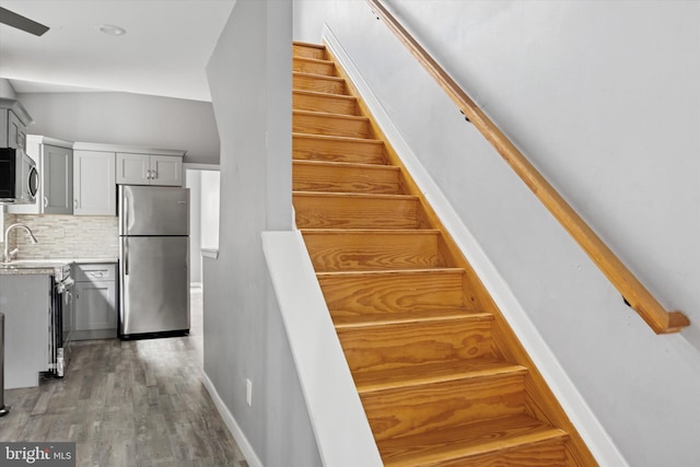 staircase with wood finished floors