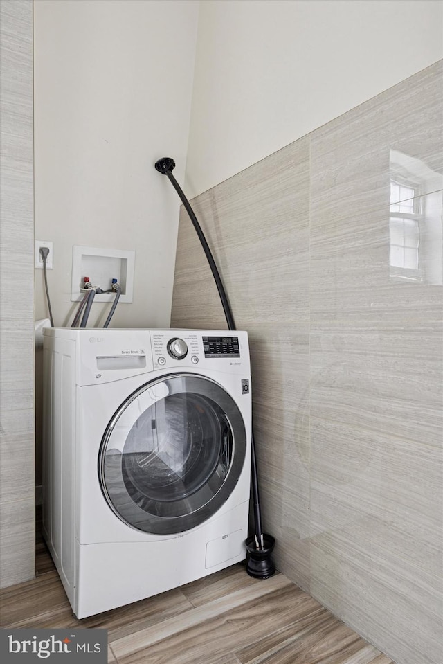 washroom with washer / dryer and laundry area