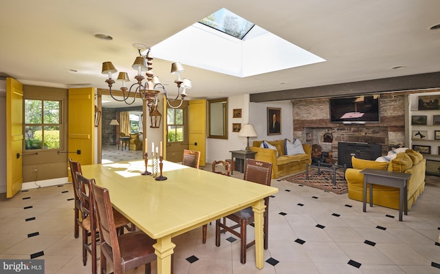 4273 Durham Rd, Kintnersville, PA 18930 - dining area with a skylight, a stone fireplace, light tile patterned flooring, and a chandelier