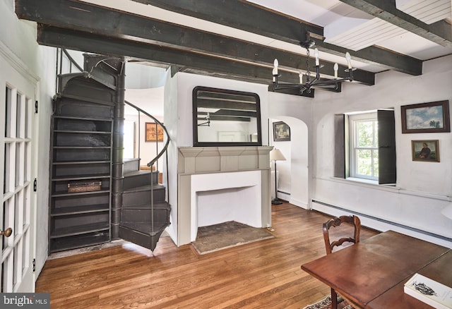 4273 Durham Rd, Kintnersville, PA 18930 - living room with stairs, arched walkways, beam ceiling, and wood finished floors