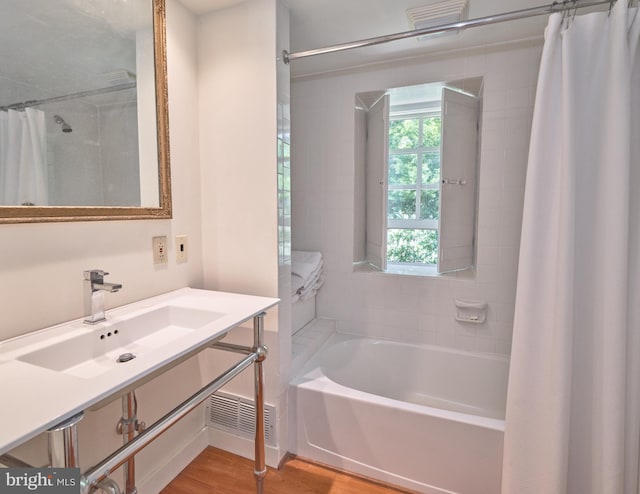 4273 Durham Rd, Kintnersville, PA 18930 - bathroom with a shower with shower curtain, a tub, a sink, and wood finished floors