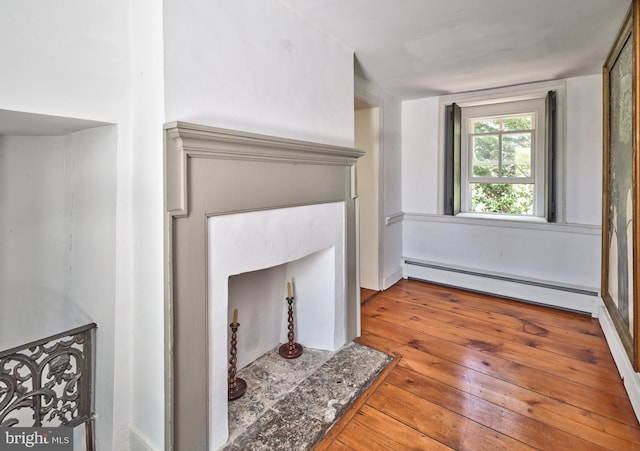 4273 Durham Rd, Kintnersville, PA 18930 - unfurnished living room with wood-type flooring and a baseboard heating unit