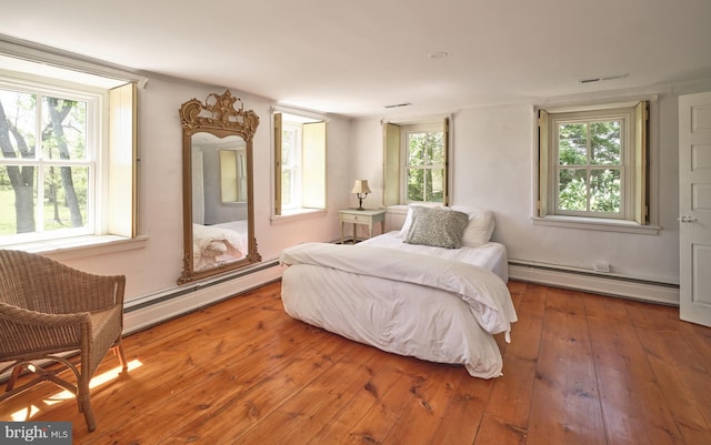 4273 Durham Rd, Kintnersville, PA 18930 - bedroom featuring visible vents, baseboard heating, and hardwood / wood-style flooring